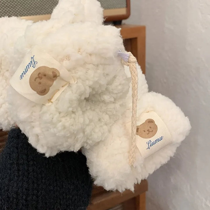 Luxurious women's teddy mittens, offering cozy warmth and a stylish look for winter.