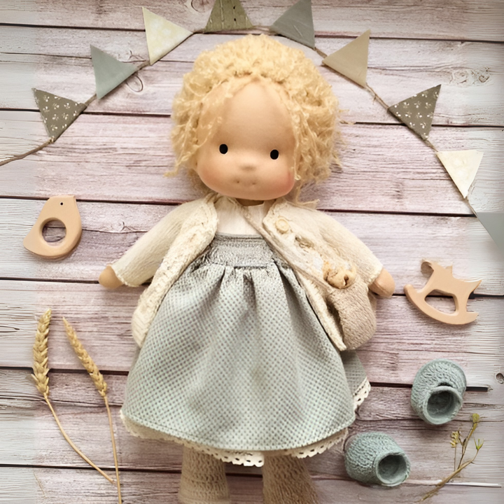 Handmade Waldorf doll for imaginative play; a natural fiber cuddly toy, ideal toddler gift.