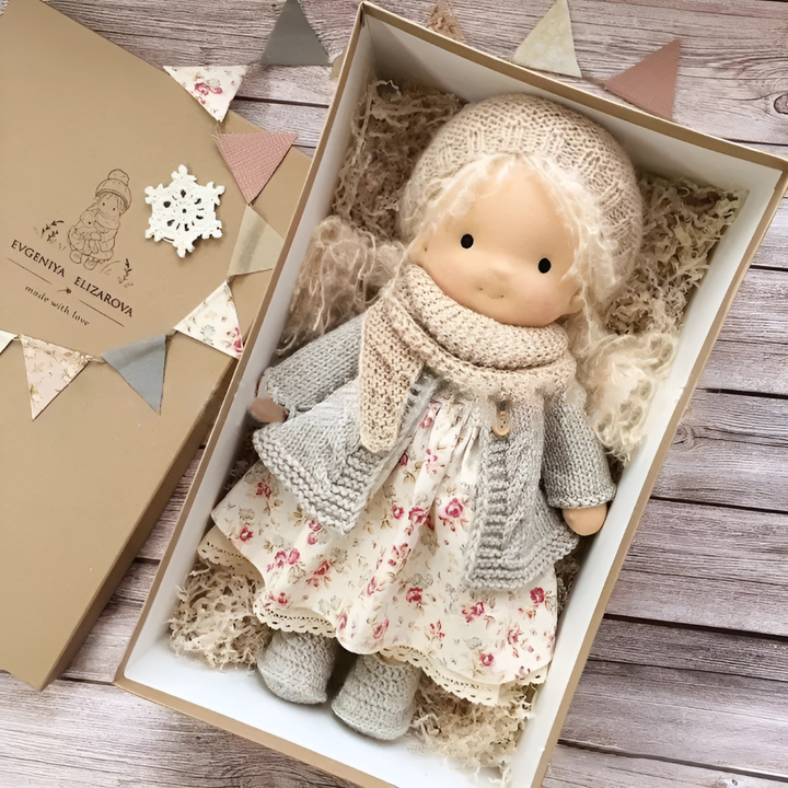 Soft Waldorf doll, an educational children's toy encouraging emotional development through play.