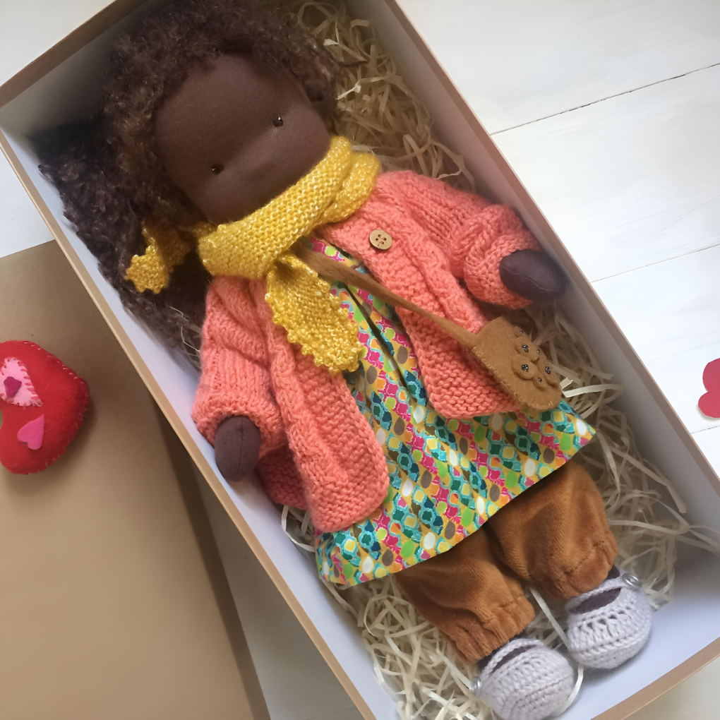 Soft, handmade Waldorf doll, perfect for little hands; an eco-friendly children's playmate.