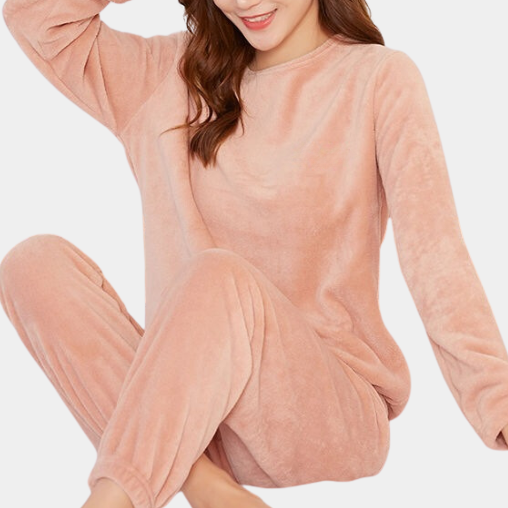 Comfortable women's soft pajama set for warm sleep. Cozy polyester loungewear, ideal for relaxation at home.
