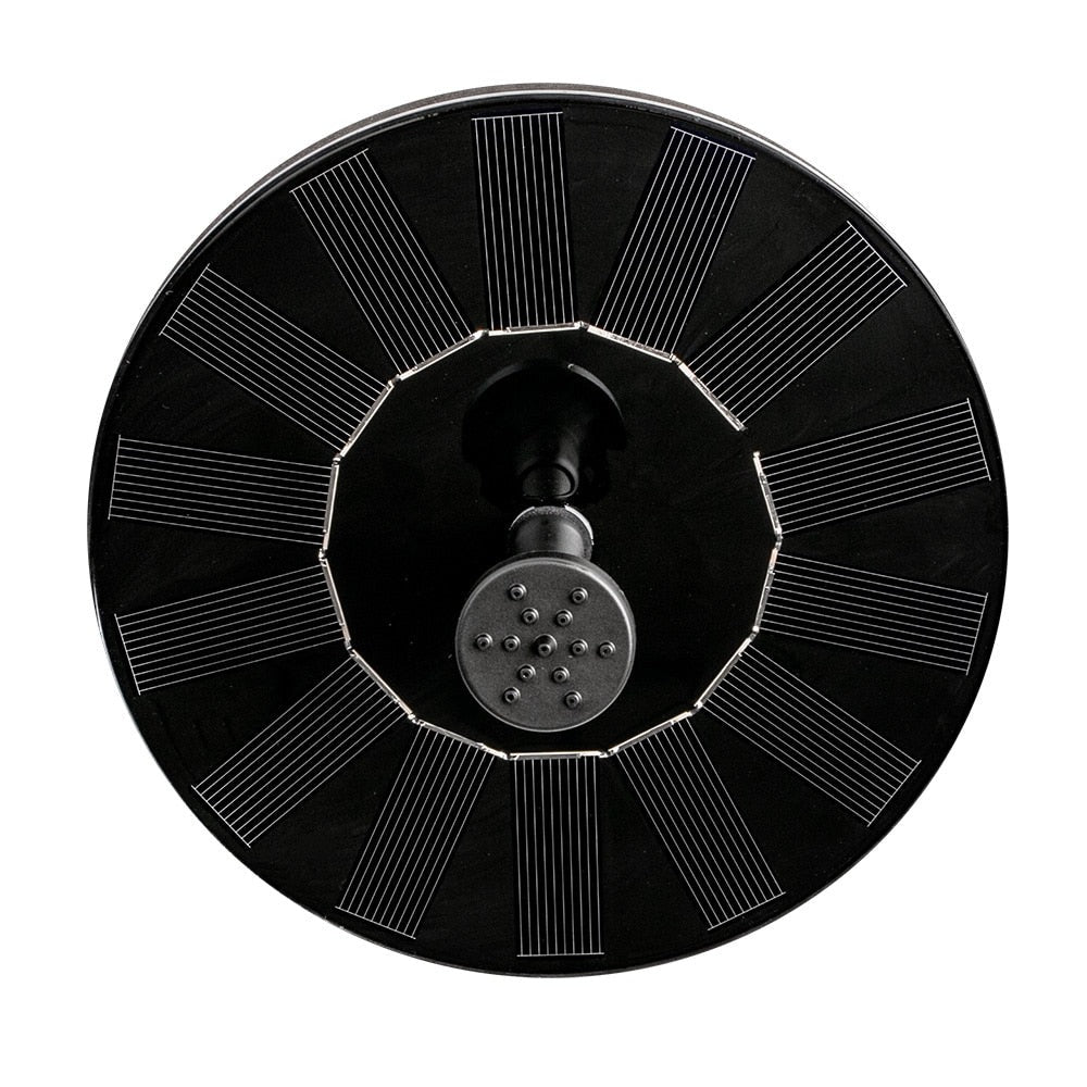 Floating solar fountain pump for bird bath or small pond. Solar-powered outdoor water feature with garden decor.