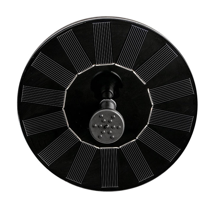 Floating solar fountain pump for bird bath or small pond. Solar-powered outdoor water feature with garden decor.