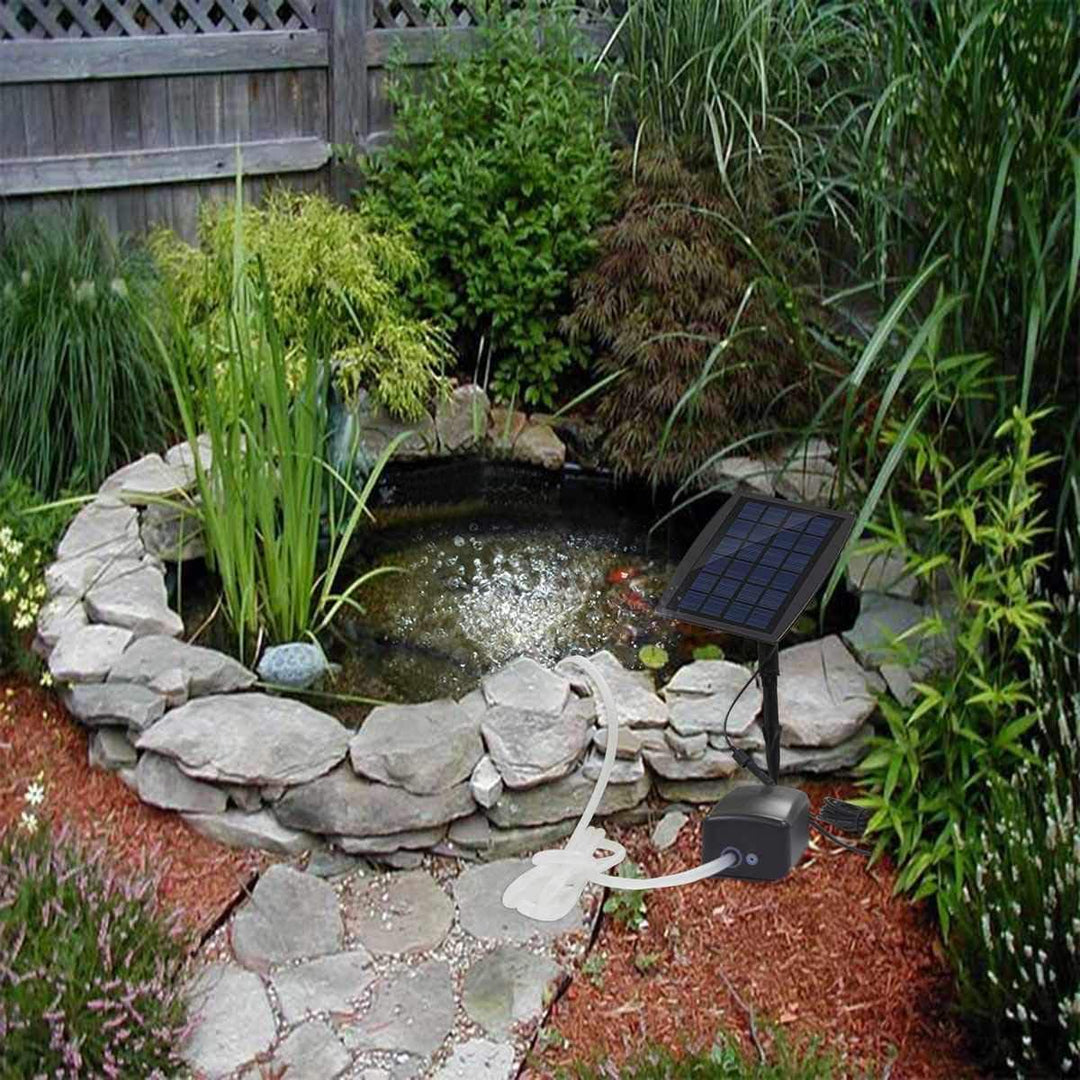 Eco-friendly solar air pump with panel, dual hoses, and two air diffusers for aquatic care.