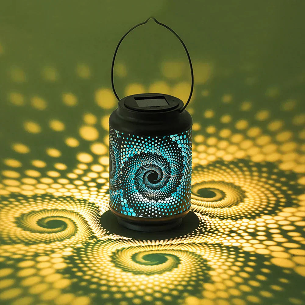 Energy efficient pathway light: a solar powered spiral lantern projecting decorative light patterns.