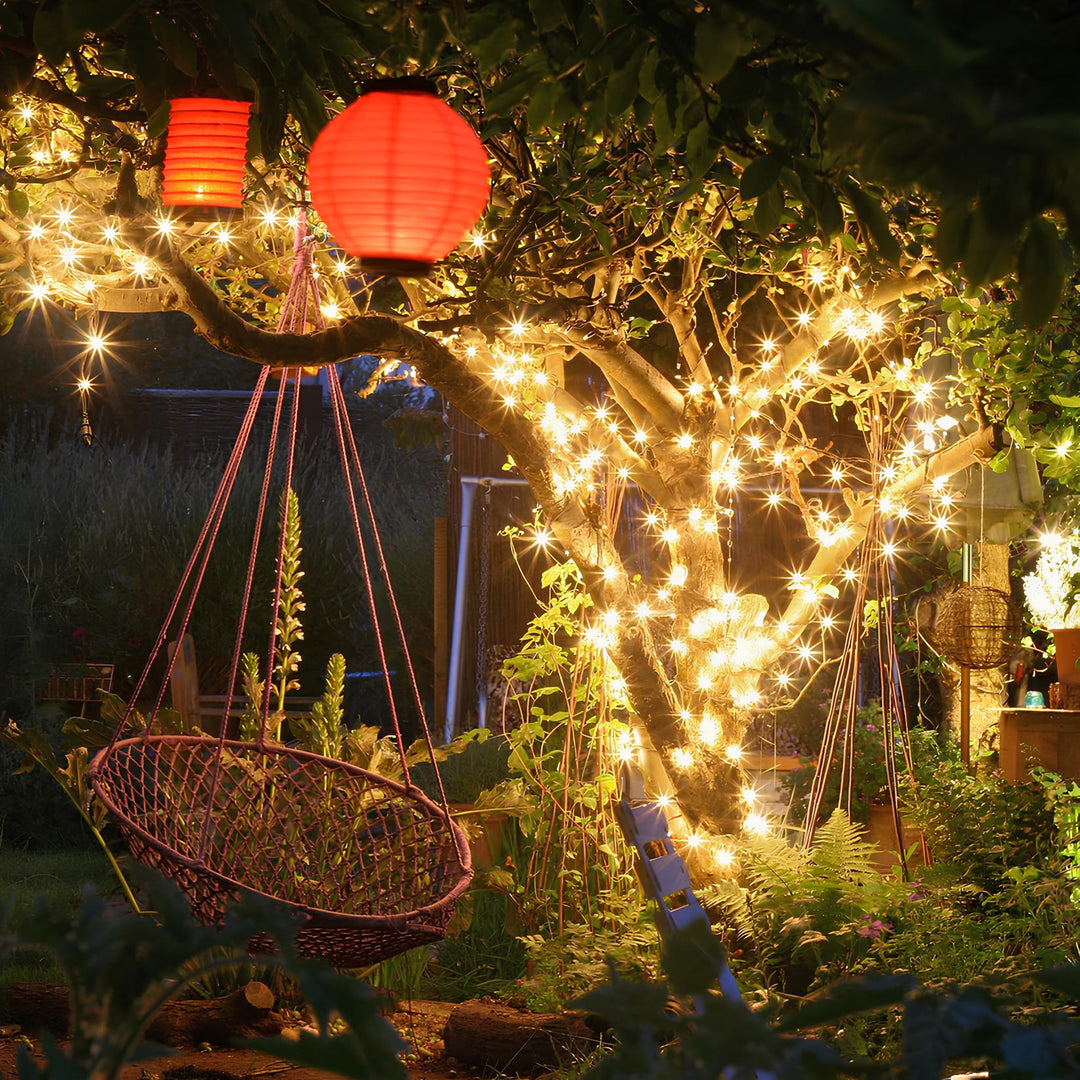 Solar powered LED string lights illuminating a garden patio for outdoor decor