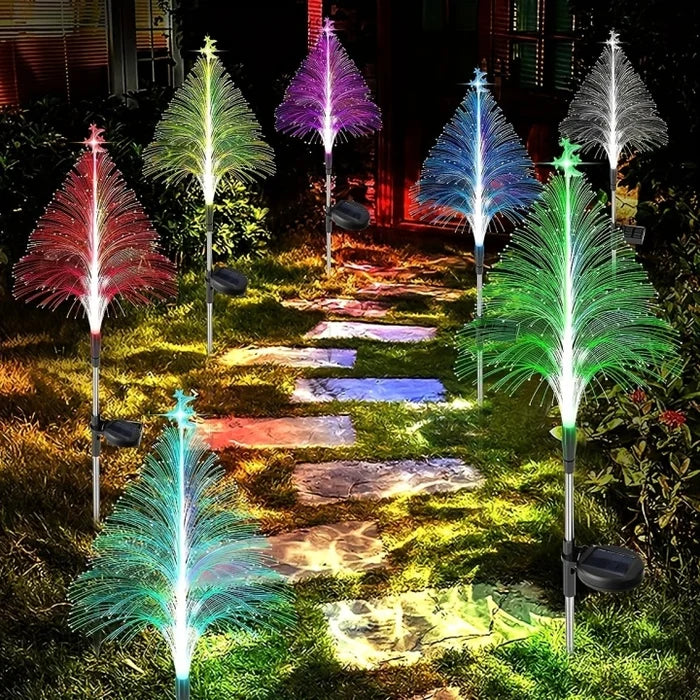 Cone-shaped solar Christmas tree lights bringing festive sparkle to outdoor gardens & patios.