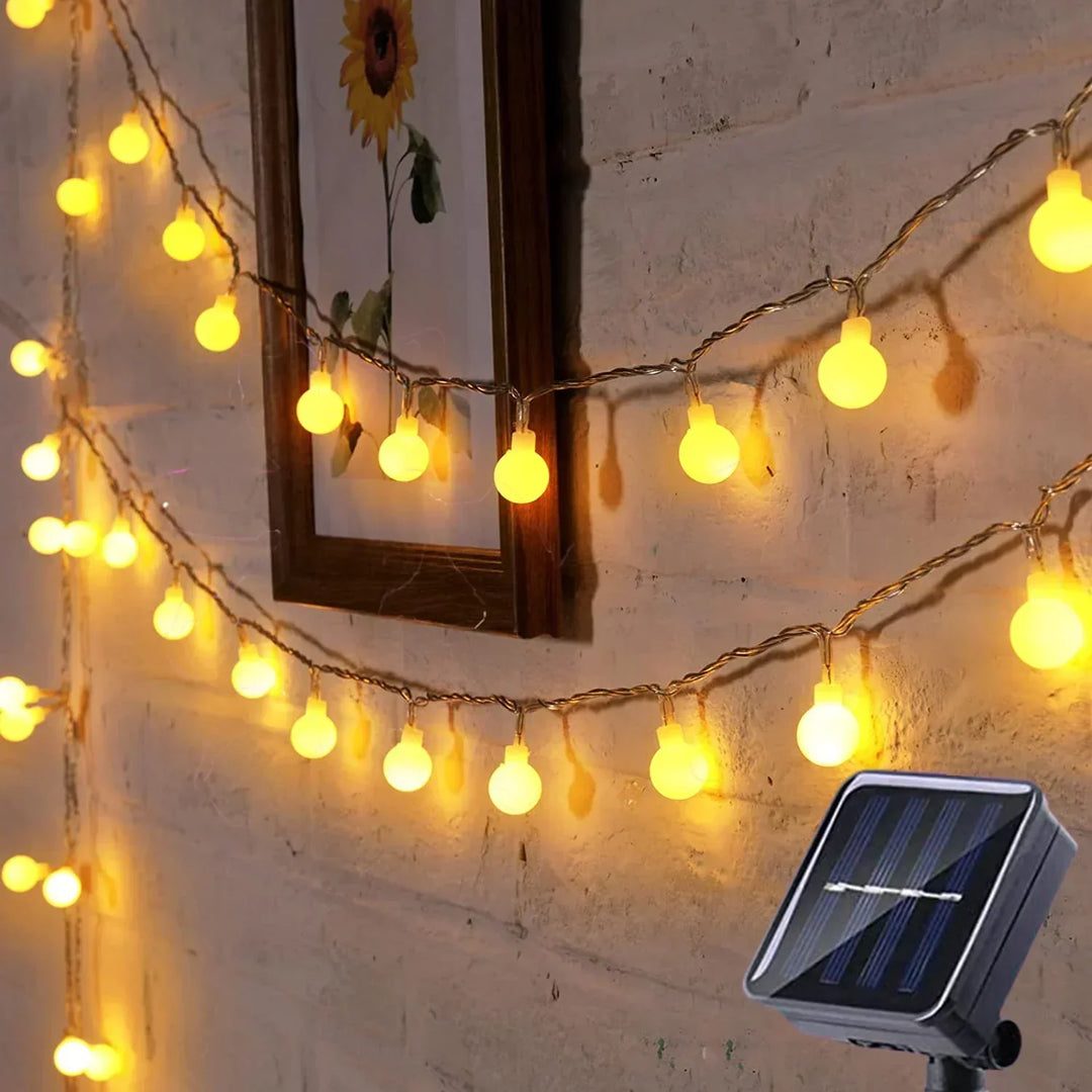 Festive solar-powered LED string lights. Ideal for party decor, garden, patio. Waterproof.