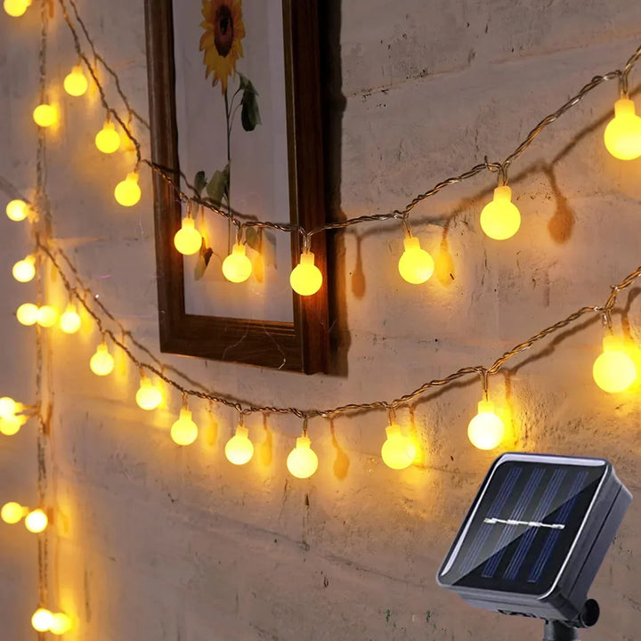 Festive solar-powered LED string lights. Ideal for party decor, garden, patio. Waterproof.