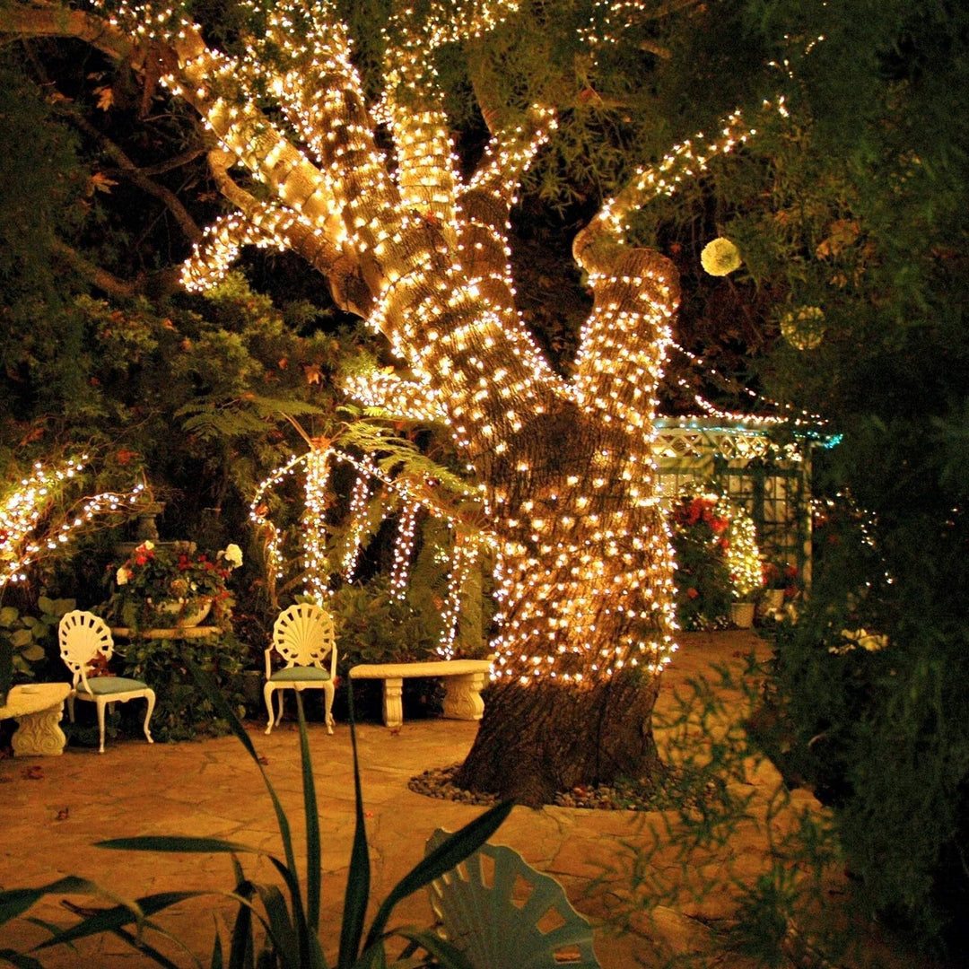SoliGlow outdoor LED string lights illuminating a dining area, romantic garden decor.
