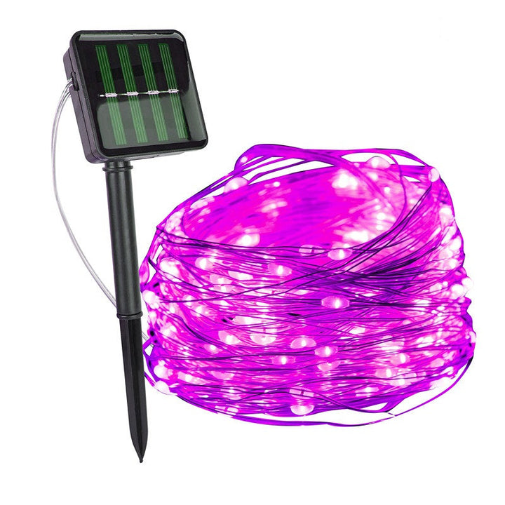 Close-up of a SoliGlow solar light bulb, durable and bright for outdoor garden decor.