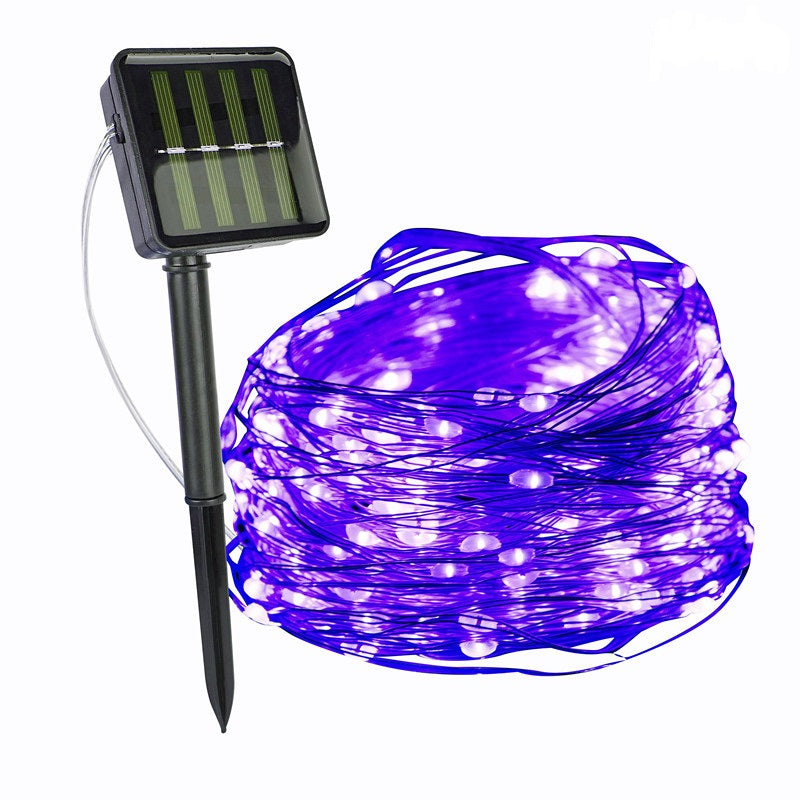 SoliGlow waterproof solar powered LED string lights draped over an outdoor seating area.