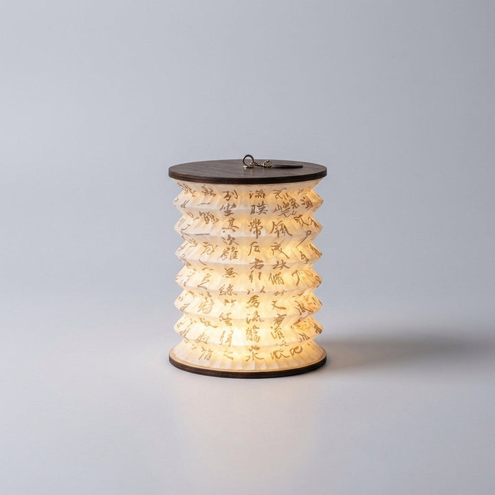 Stylish LED lantern table lamp on a wooden surface, showcasing its design and warm LED lighting.