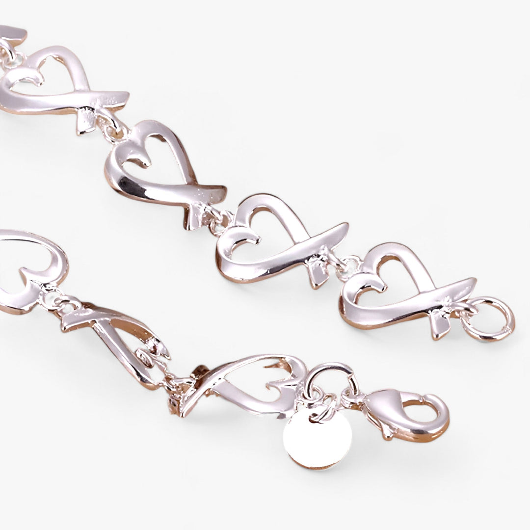 Elegant women's silver bracelet featuring a beautiful, timeless charm