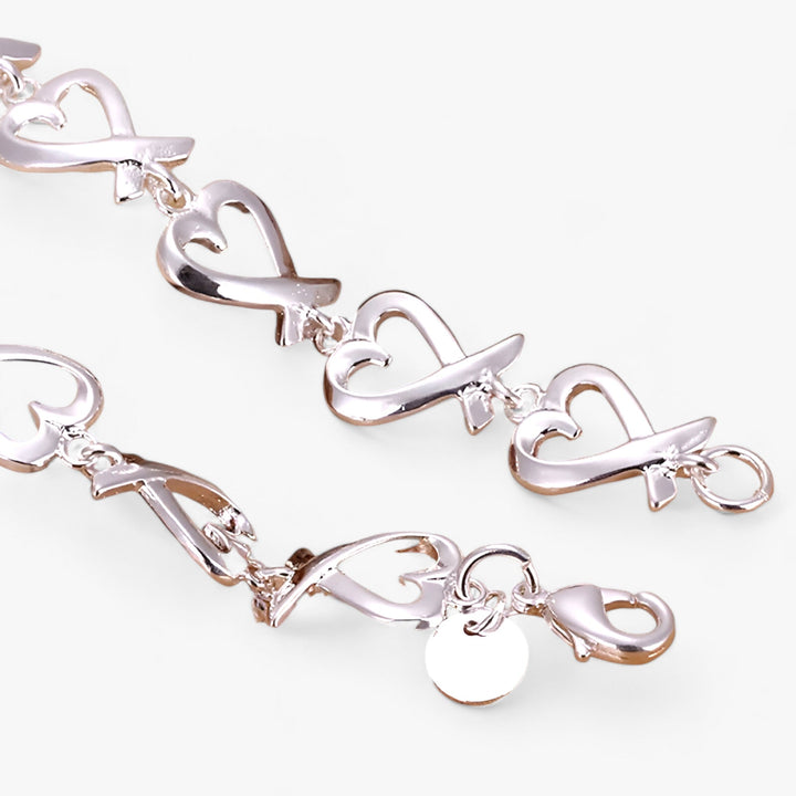 Elegant women's silver bracelet featuring a beautiful, timeless charm