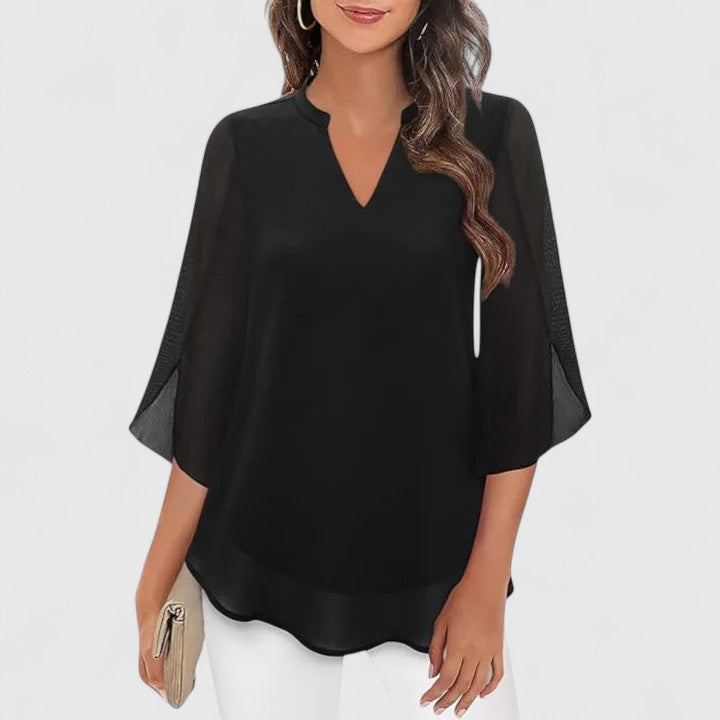 Stylish women's sophisticated blouse, easily transitions from elegant office wear to chic evening attire.