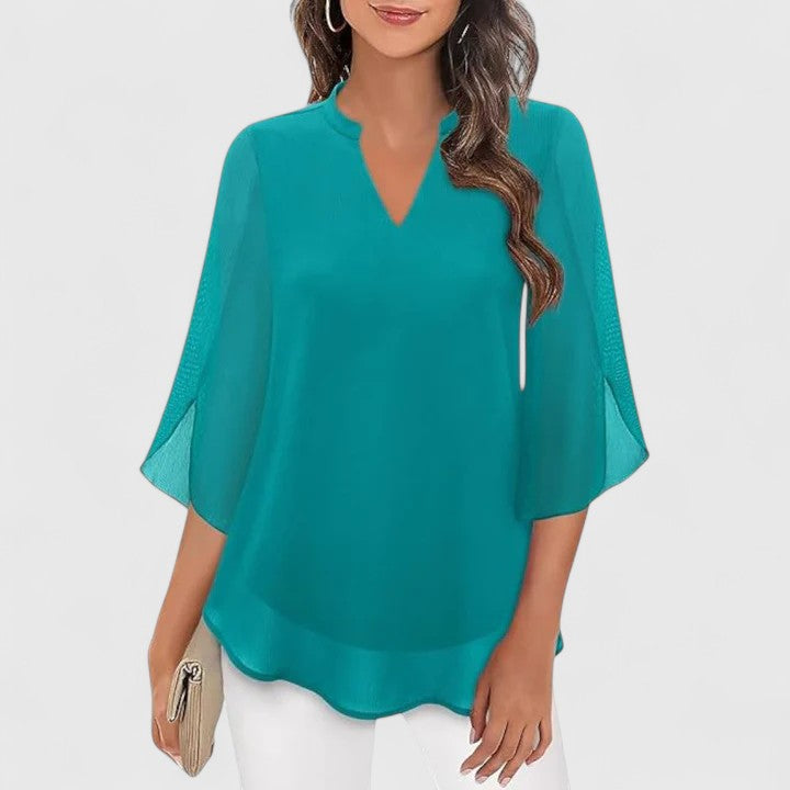Modern women's blouse with a sophisticated design, great for versatile office and elegant evening wear.