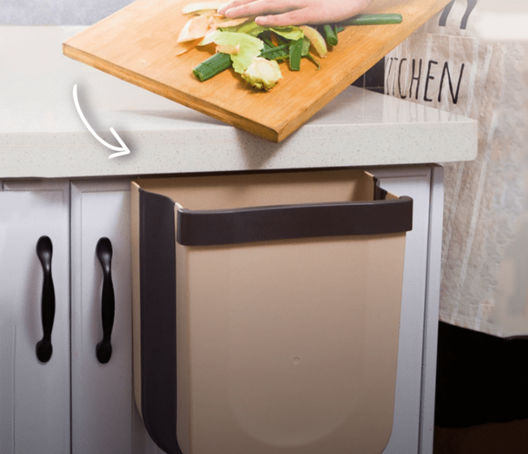 White foldable wall waste bin for kitchen, optimizing space. Ideal for daily garbage & efficient home storage.