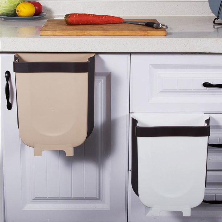 Convenient wall-mounted foldable garbage can, ideal for kitchen cabinets, saving space & keeping areas tidy.