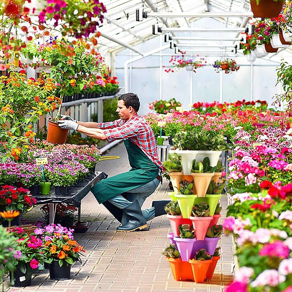 Durable plastic stackable plant pots, creating a vibrant vertical garden on any patio or balcony.