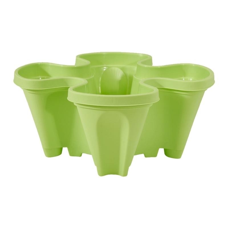 Stackable herb garden planter in durable plastic, perfect for fresh herbs on a small patio.