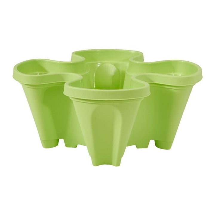 Stackable herb garden planter in durable plastic, perfect for fresh herbs on a small patio.