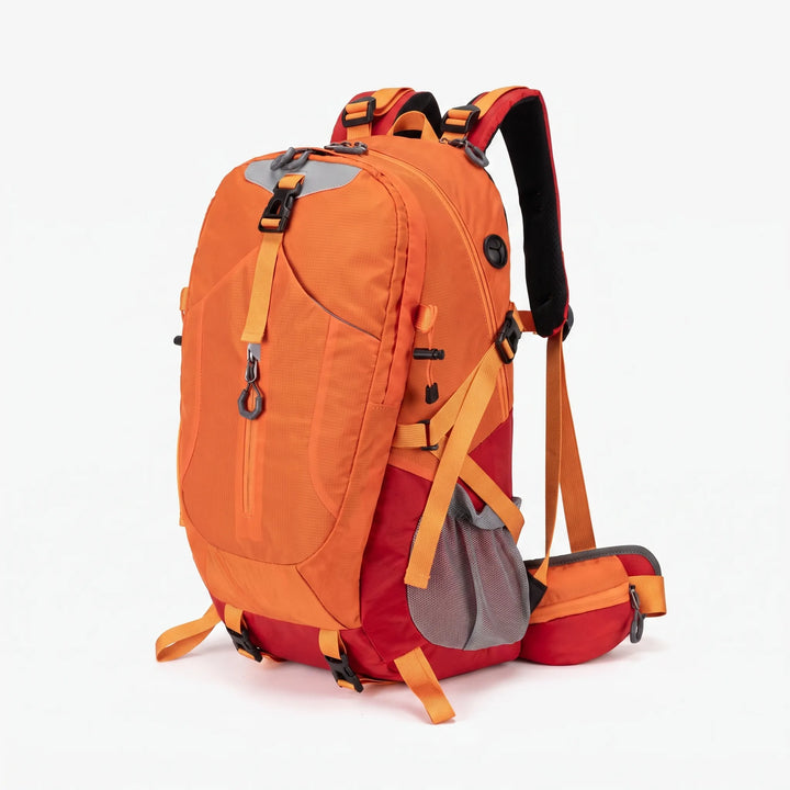 Hiker wearing an 11-gallon water-resistant hiking backpack on a trail, ready for outdoor adventure.