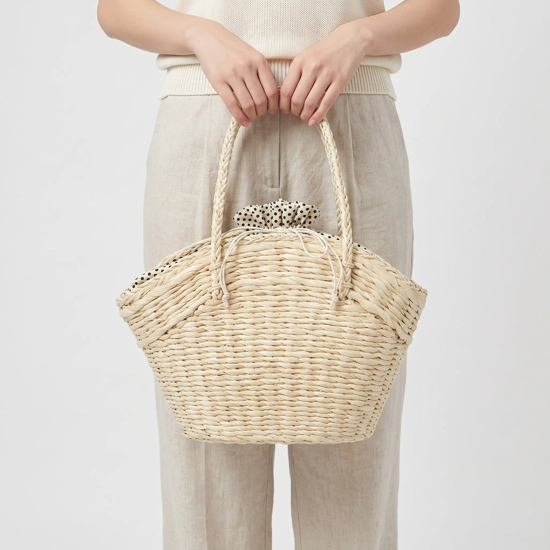 Women's stylish beige woven shoulder tote bag, ideal for beach, travel, and summer vacations.