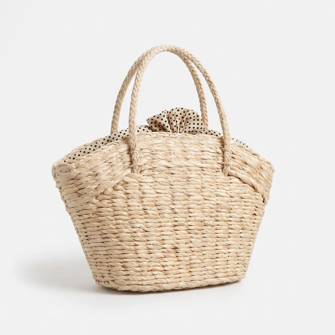 Versatile women's beige woven summer tote bag, great for beach days, travel, or casual outings.