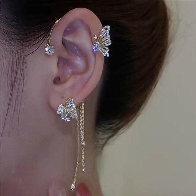 Women's sparkling butterfly ear cuffs. Non-piercing rhinestone clip-on accessory, elegant fashion jewelry.