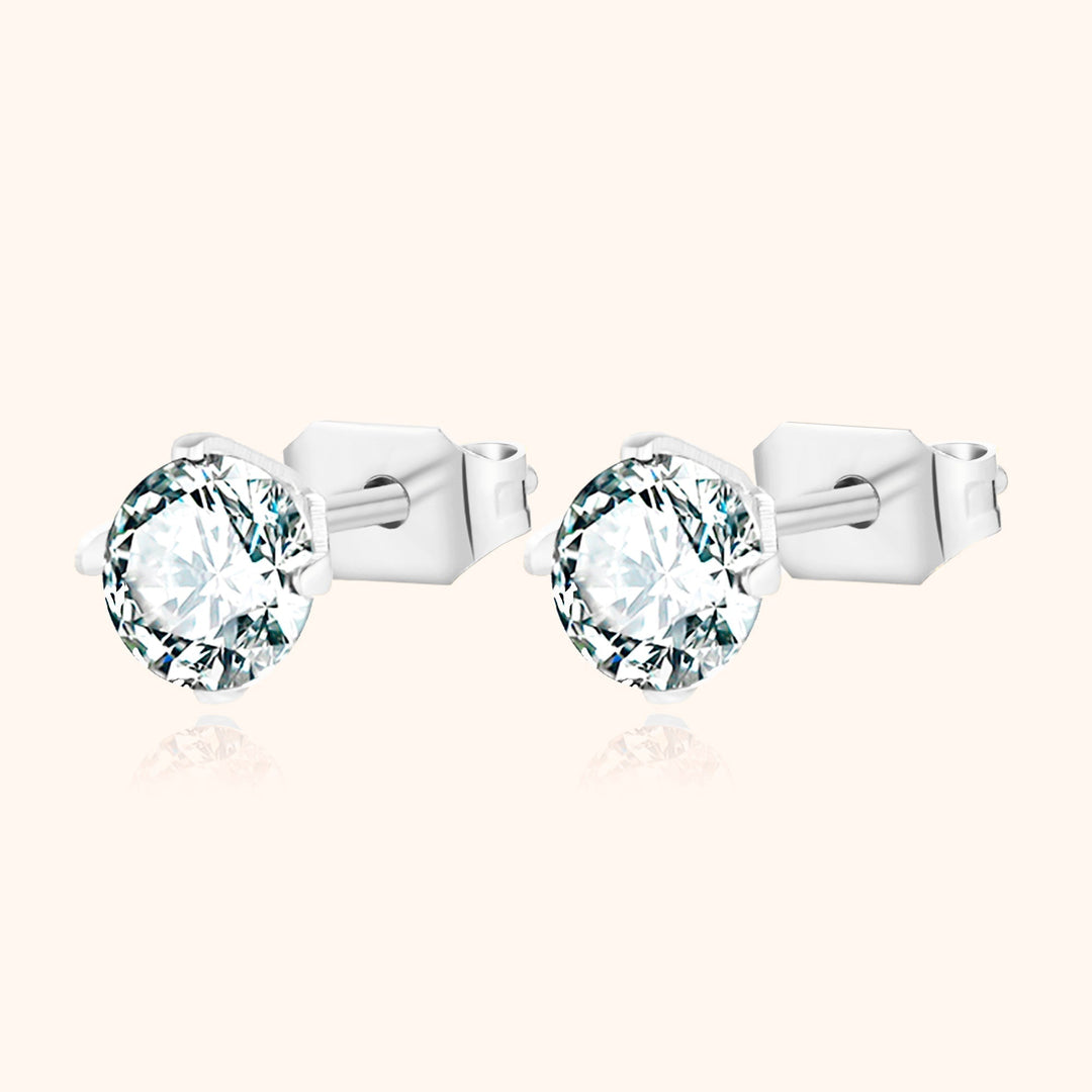 Gift-ready sparkling cubic zirconia mini earrings. Dainty sterling silver jewelry for any occasion.