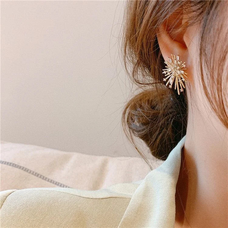 Beautiful sparkling gold firework zirconia earrings, an elegant gift for her, enhancing any outfit.