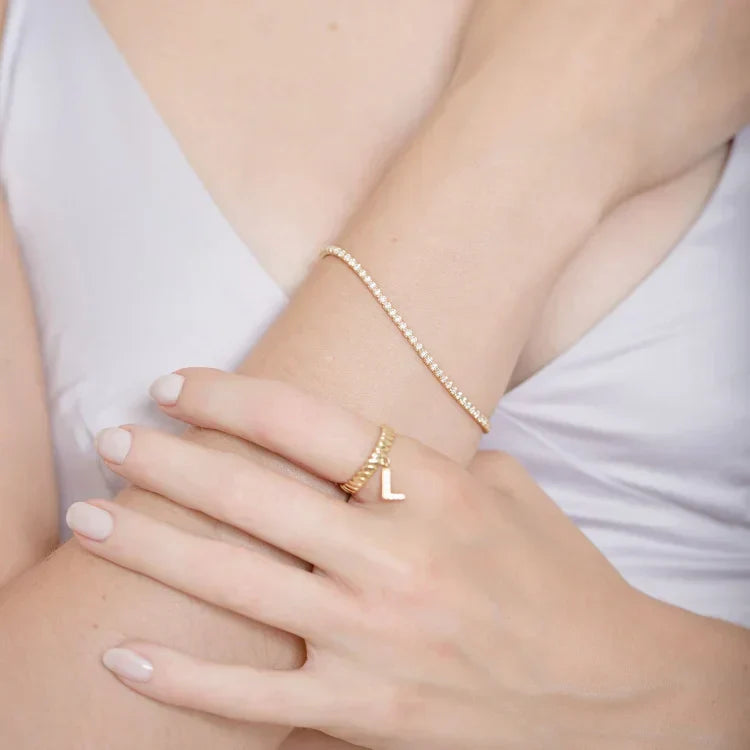 Stylish gold-plated iced bracelet, featuring sparkling stones. A beautiful and elegant women's fashion accessory.