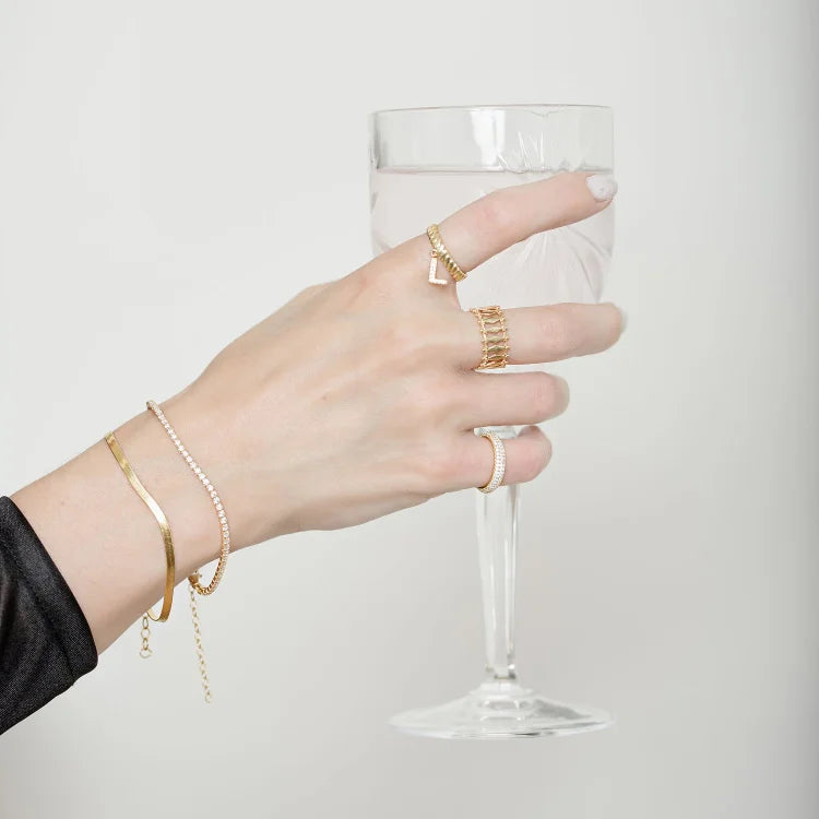 Close-up of a sparkling women's iced bracelet. Gold-plated, elegant design. Perfect as a gift or statement jewelry.