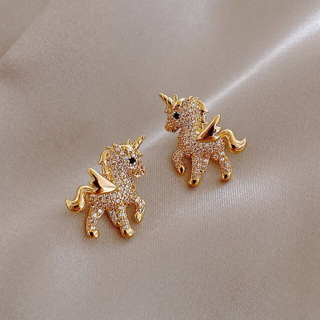 Sparkling golden unicorn zirconia stud earrings for women, magical fantasy jewelry gift.