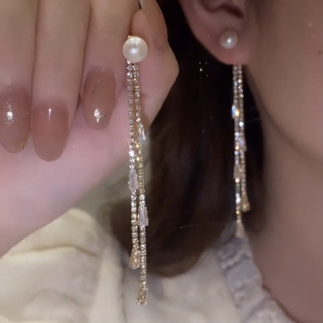 A pair of glamorous rhinestone dangle earrings, perfect for evening wear and parties.