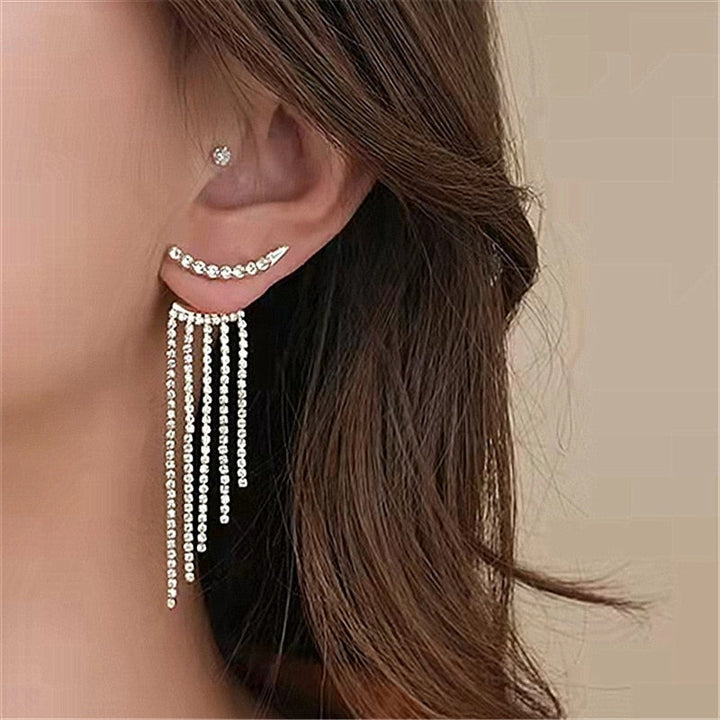 Fashion accessory: Sparkling silver tone dangle earrings with clear rhinestones.