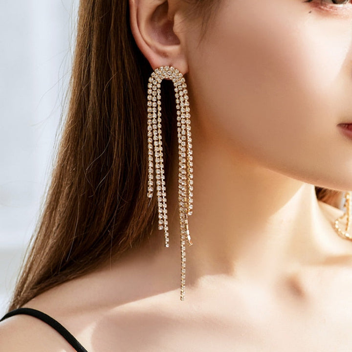 Close-up of dazzling rhinestone dangle earrings, perfect for special occasions.