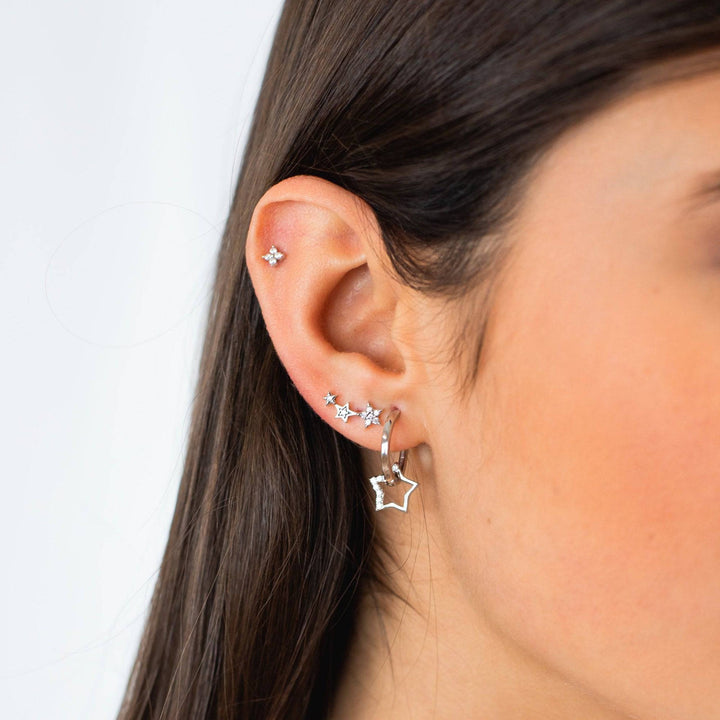 Gold plated sterling silver hoop earrings with sparkling star charms, perfect dangle earrings for women.