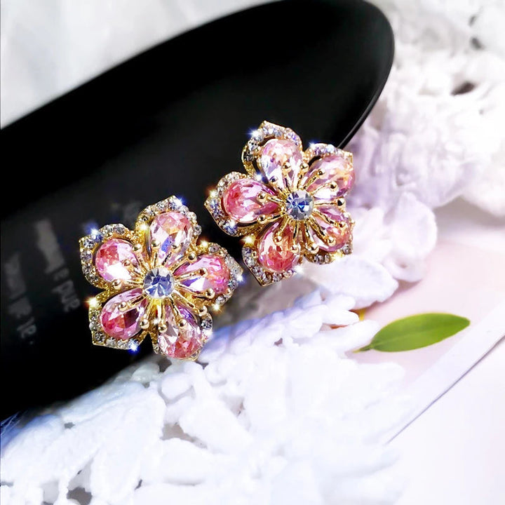Elegant women's sterling silver dangle earrings with vibrant rainbow zirconia stones, perfect for fashion.
