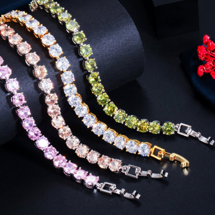 Adjustable silver-tone tennis bracelet with shimmering crystal hearts for women, a stylish accessory.