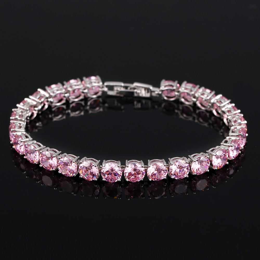 Women's shimmering crystal heart tennis bracelet, ideal for adding sparkle to any outfit.