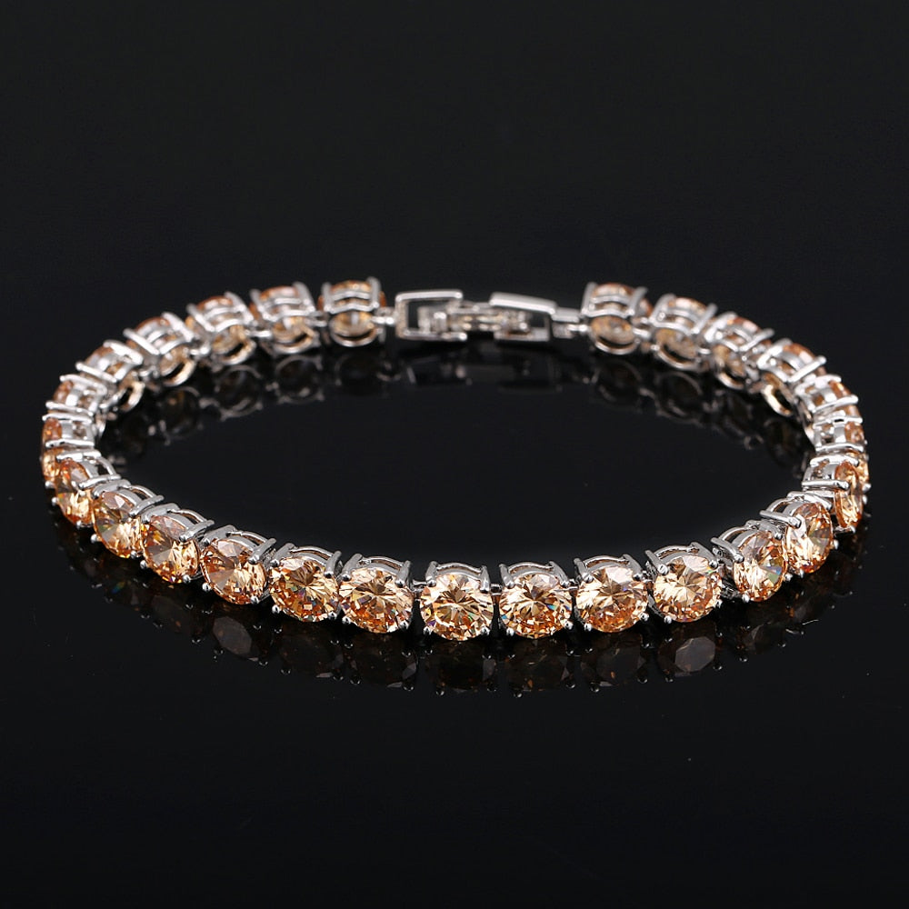 Adjustable women's tennis bracelet featuring numerous sparkling crystal hearts, gift for her.