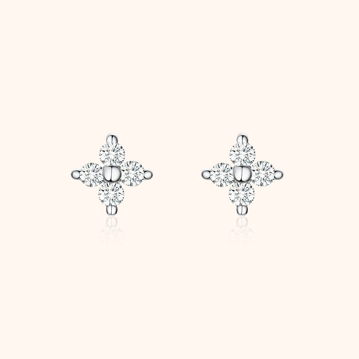 Sparkling women's flower zirconia stud earrings. Delicate sterling silver jewelry, perfect for elegant everyday wear.