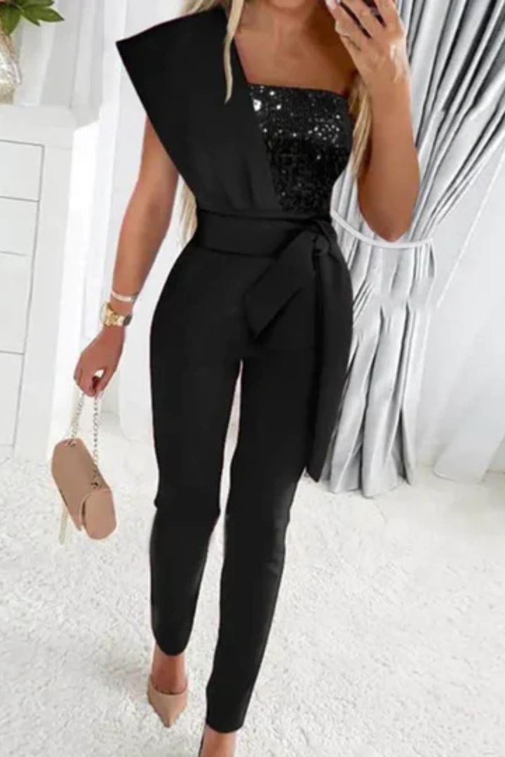 Close-up of the glittering fabric on a women's sequin jumpsuit, highlighting the chic design for formal events.