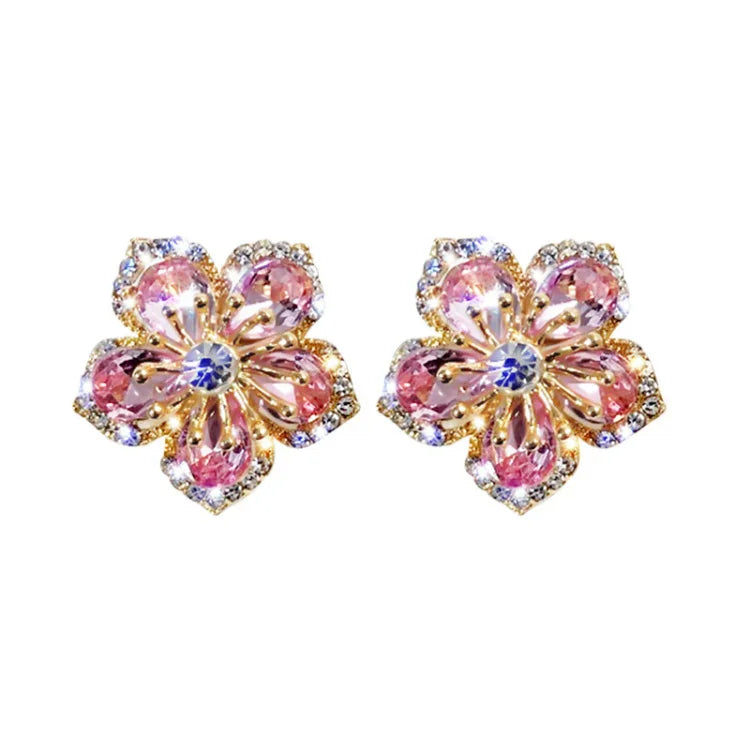 Sparkling women's zirconia flower stud earrings in sterling silver. Elegant floral jewelry for everyday wear.