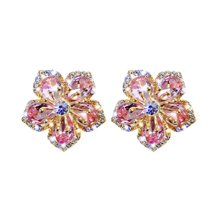 Sparkling women's zirconia flower stud earrings in sterling silver. Elegant floral jewelry for everyday wear.
