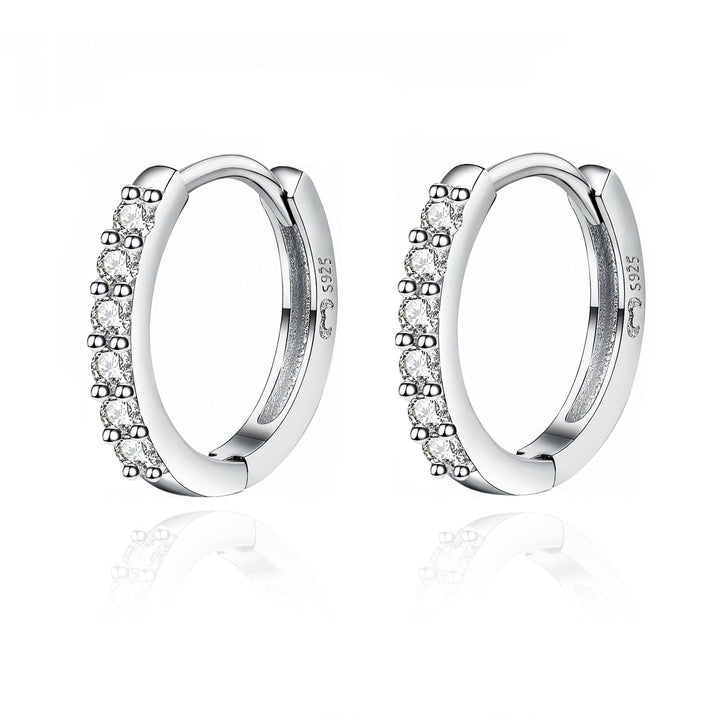 Sparkling women's zirconia hoop earrings, silver and gold plated. Elegant fine jewelry for her.