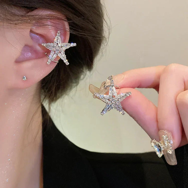 Sparkling women's zirconia star earrings & ear cuff set. Silver-tone celestial jewelry, a trendy fashion accessory.