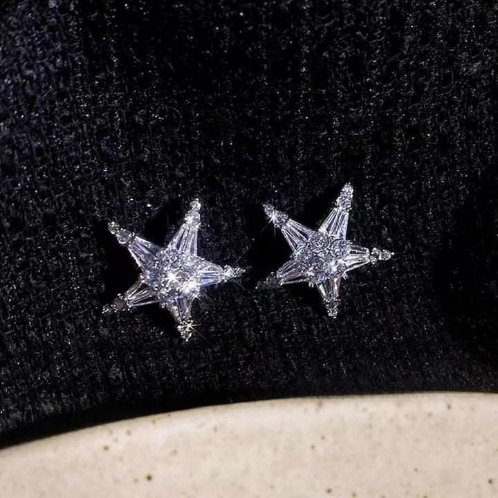 Elegant zirconia star earrings & matching ear cuff for women. Silver-plated, sparkly fashion accessory, celestial design.